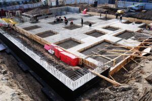 An ongoing construction of concrete foundation for a commercial space